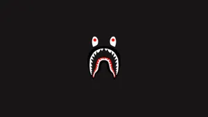 A Black Background With A Red Shark Face Wallpaper