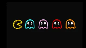 A Black Background With The Words Pac Man Wallpaper