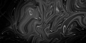 A Black Marble Surface Reflecting Light Wallpaper