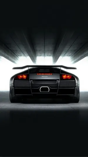 A Black Sports Car In A Dark Tunnel Wallpaper