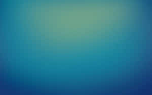 A Blue And Green Blurred Background Wallpaper