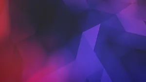 A Blue And Purple Desktop With A Laptop And Supplies Wallpaper