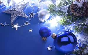 A Blue Background With A Christmas Tree And Ornaments Wallpaper