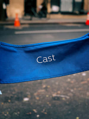 A Blue Chair With The Word Cast On It Wallpaper