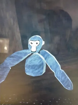 A Blue Stuffed Animal Is Sitting On A Table Wallpaper