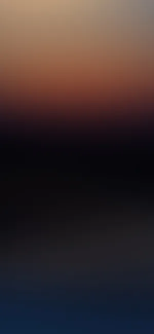 A Blurry Image Of The Night Sky Illuminated In Black Wallpaper