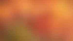 A Bright Red Spot In A Blurred Background. Wallpaper