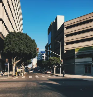 A Bustling City Street During The Day Wallpaper
