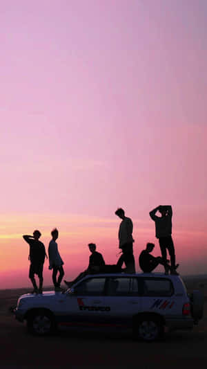 A Car With People On Top Wallpaper