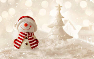 A Cheery Snowman Frosty Welcomes Us With The Coming Of Winter Wallpaper