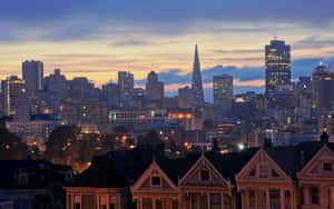 A City Skyline At Dusk Wallpaper