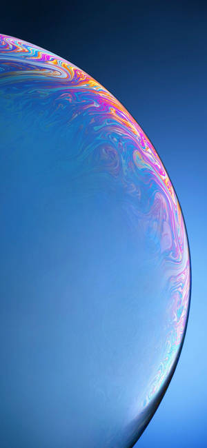 A Close Up Of A Blue Bubble With A Colorful Background Wallpaper