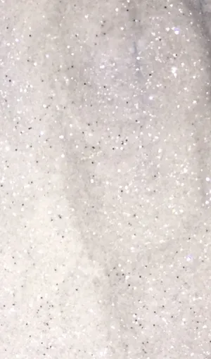 A Close Up Of A White And Silver Glitter Wallpaper