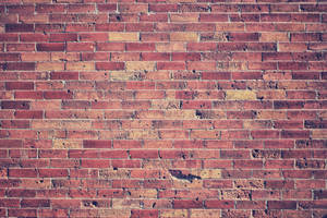 A Close-up View Of Aged, Stacked Bricks. Wallpaper
