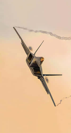 A Closeup Of An F-22 Raptor Jet In Flight Wallpaper