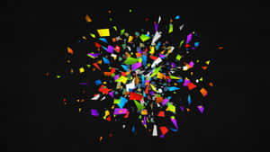 A Colorful Explosion Of Confetti On A Black Background Wallpaper