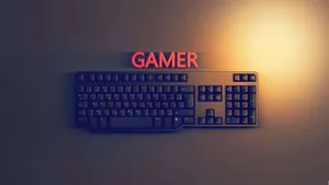A Computer Keyboard With The Word Gamer On It Wallpaper