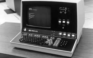 A Computer With A Keyboard On Top Of It Wallpaper