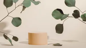 A Cylinder With Eucalyptus Leaves On It Wallpaper
