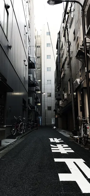 A Dark Japanese Iphone In A Cityscape Wallpaper