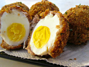 A Decadent Dish Of Crunchy Scotch Eggs Wallpaper