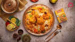 A Delicious Plate Of Golden Yellow Biryani Wallpaper