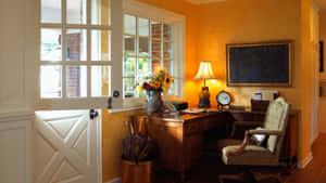 A Desk In A Room With A Door Wallpaper