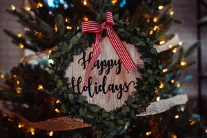 A Desktop Pc Adorned With Christmas Decorations Wallpaper