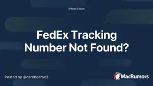 A Fedex Employee Scanning A Package With A Barcode Scanner. Wallpaper