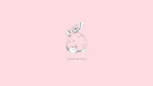 A Fluffy Pink Bunny Resting In A Patch Of Grass Wallpaper