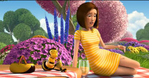 A Girl In A Yellow Dress Is Sitting On A Picnic Blanket Wallpaper