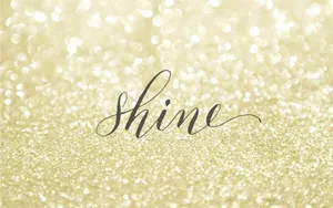 A Gold Glitter Background With The Word Shine Wallpaper
