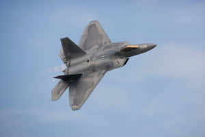 A Gray Jet Flying In The Sky Wallpaper