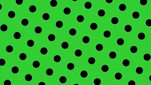 A Green Background With Black Dots Wallpaper