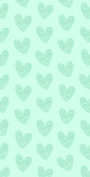 A Green Background With Hearts On It Wallpaper