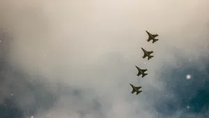 A Group Of Fighter Jets Flying In The Sky Wallpaper