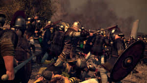 A Group Of Men In Armor Fighting In A Battle Wallpaper