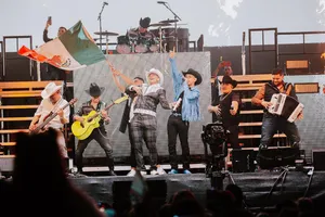 A Group Of People On Stage With A Mexican Flag Wallpaper