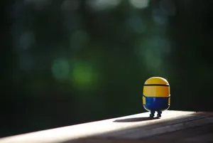 A Group Of Playful Minions Celebrating Wallpaper