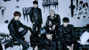 A Group Of Young Men In Black Leather Clothing Wallpaper