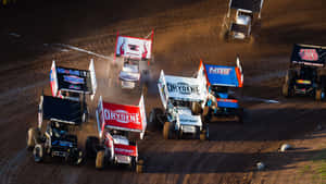 A High-powered Sprint Car Racing Around The Bend. Wallpaper
