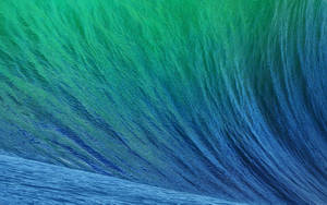 A Macbook Air In A Distinctive Aqua Color Wallpaper