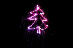 A Magenta Christmas Lights Tree Against A Starry Night Sky. Wallpaper