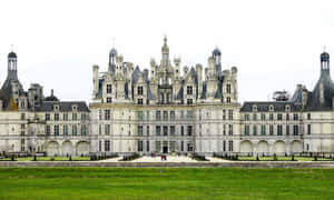 A Majestic View Of Chateau De Chambord Wallpaper