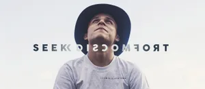 A Man In A Hat With The Words Trocco See Wallpaper