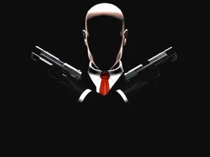 A Man In A Suit Holding Two Guns Wallpaper