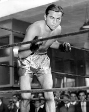 A Man In Boxing Shorts Standing In A Ring Wallpaper