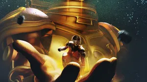 A Man Is Holding A Golden Robot In His Hand Wallpaper