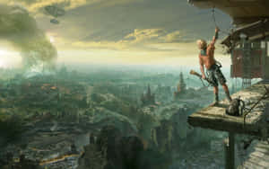 A Man Is Standing On A Ledge Overlooking A City Wallpaper