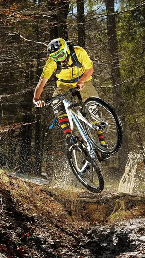 A Man Riding A Mountain Bike Wallpaper